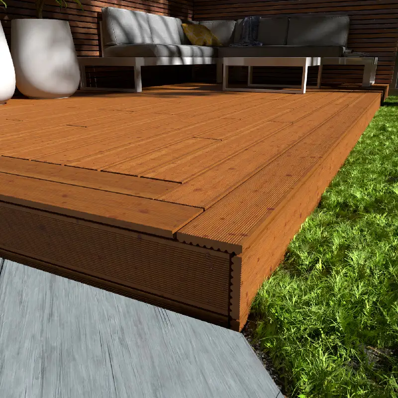 Brown wood decking with grooved planks and grass edge.