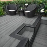 Grey composite decking with black trim step and chairs.